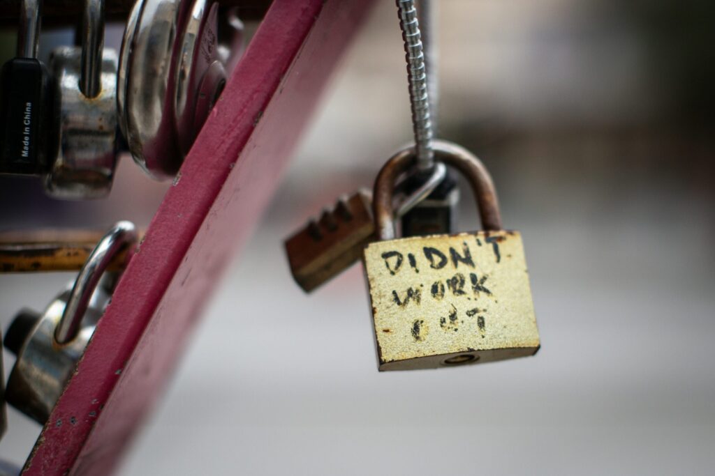 a padlock attached to a metal wire with words didn't work